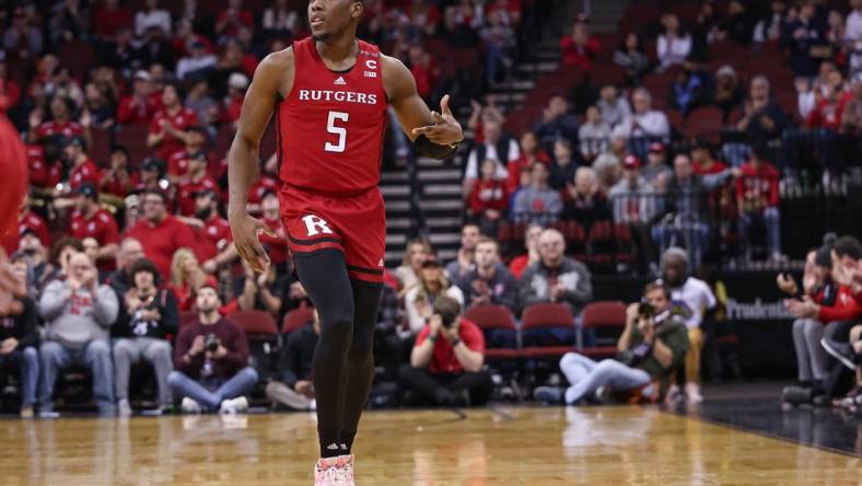 Dec 23, 2023; Newark, NY, USA; Rutgers Scarlet Knights forward Aundre Hyatt (5) reacts after a three point basket during the first half against the Mississippi State Bulldogs at Prudential Center. Mandatory Credit: Vincent Carchietta-USA TODAY Sports