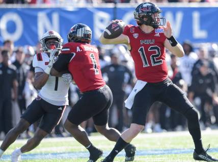 Northern Illinois Huskies quarterback Rocky Lombardi (12) passes against the Arkansas State Red Wolves in first half action in the Camellia Bowl at Cramton Bowl in Montgomery, Ala., on Saturday December 23, 2023.