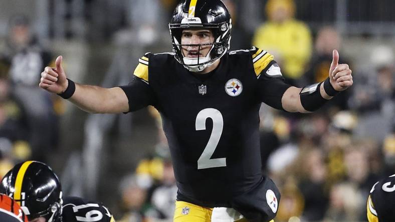 Dec 23, 2023; Pittsburgh, Pennsylvania, USA; Pittsburgh Steelers quarterback Mason Rudolph (2) gestures at the line of scrimmage against the Cincinnati Bengals during the second quarter at Acrisure Stadium. Mandatory Credit: Charles LeClaire-USA TODAY Sports