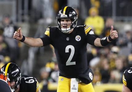 Dec 23, 2023; Pittsburgh, Pennsylvania, USA; Pittsburgh Steelers quarterback Mason Rudolph (2) gestures at the line of scrimmage against the Cincinnati Bengals during the second quarter at Acrisure Stadium. Mandatory Credit: Charles LeClaire-USA TODAY Sports