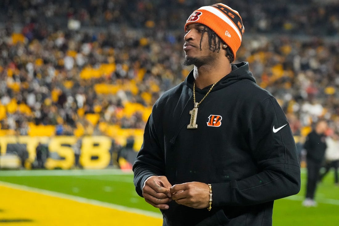 Injured Cincinnati Bengals wide receiver Ja'Marr Chase (1) walks to the locker room at halftime of the NFL 16 game between the Pittsburgh Steelers and the Cincinnati Bengals at Acrisure Stadium in Pittsburgh on Saturday, Dec. 23, 2023. The Steelers led 24-0 at halftime.