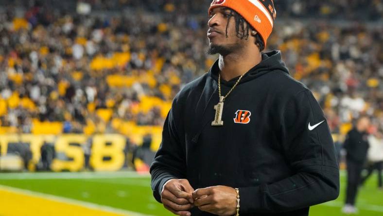 Injured Cincinnati Bengals wide receiver Ja'Marr Chase (1) walks to the locker room at halftime of the NFL 16 game between the Pittsburgh Steelers and the Cincinnati Bengals at Acrisure Stadium in Pittsburgh on Saturday, Dec. 23, 2023. The Steelers led 24-0 at halftime.