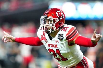 Dec 23, 2023; Las Vagas, NV, USA; Utah Utes linebacker Karene Reid (21) warms up before a game against the Northwestern Wildcats at Allegiant Stadium. Mandatory Credit: Stephen R. Sylvanie-USA TODAY Sports