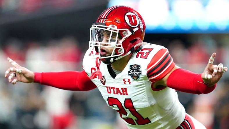 Dec 23, 2023; Las Vagas, NV, USA; Utah Utes linebacker Karene Reid (21) warms up before a game against the Northwestern Wildcats at Allegiant Stadium. Mandatory Credit: Stephen R. Sylvanie-USA TODAY Sports