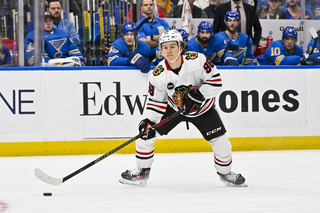Dec 23, 2023; St. Louis, Missouri, USA;  Chicago Blackhawks center Connor Bedard (98) controls the puck against the St. Louis Blues during the first period at Enterprise Center. Mandatory Credit: Jeff Curry-USA TODAY Sports