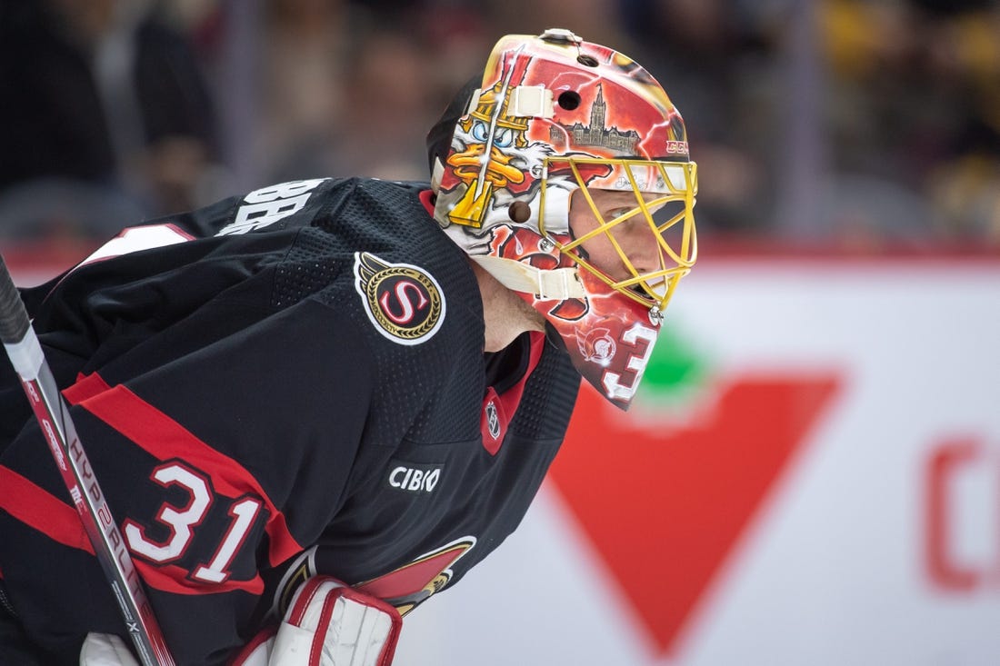 Dec 23, 2023; Ottawa, Ontario, CAN; Ottawa Senators goalie Anton Forsberg (31) looks up the ice prior to the start of the second period against the Pittsburgh Penguins at the Canadian Tire Centre. Mandatory Credit: Marc DesRosiers-USA TODAY Sports