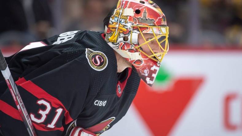 Dec 23, 2023; Ottawa, Ontario, CAN; Ottawa Senators goalie Anton Forsberg (31) looks up the ice prior to the start of the second period against the Pittsburgh Penguins at the Canadian Tire Centre. Mandatory Credit: Marc DesRosiers-USA TODAY Sports