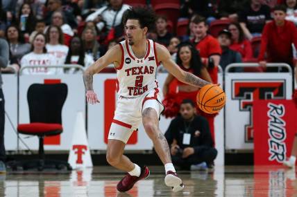Dec 21, 2023; Lubbock, Texas, USA;  Texas Tech Red Raiders guard Pop Isaacs (2) dribbles the ball against the Texas-Arlington Mavericks in the first half at United Supermarkets Arena. Mandatory Credit: Michael C. Johnson-USA TODAY Sports
