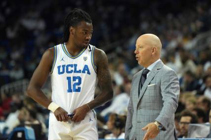 Dec 22, 2023; Los Angeles, California, USA; UCLA Bruins head coach MIck Cronin (right) talks with guard Sebastian Mack (12) against the Maryland Terrapins in the second half at Pauley Pavilion presented by Wescom. Mandatory Credit: Kirby Lee-USA TODAY Sports