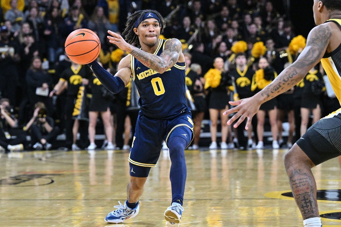 Dec 10, 2023; Iowa City, Iowa, USA; Michigan Wolverines guard Dug McDaniel (0) in action during the game against the Iowa Hawkeyes at Carver-Hawkeye Arena. Mandatory Credit: Jeffrey Becker-USA TODAY Sports