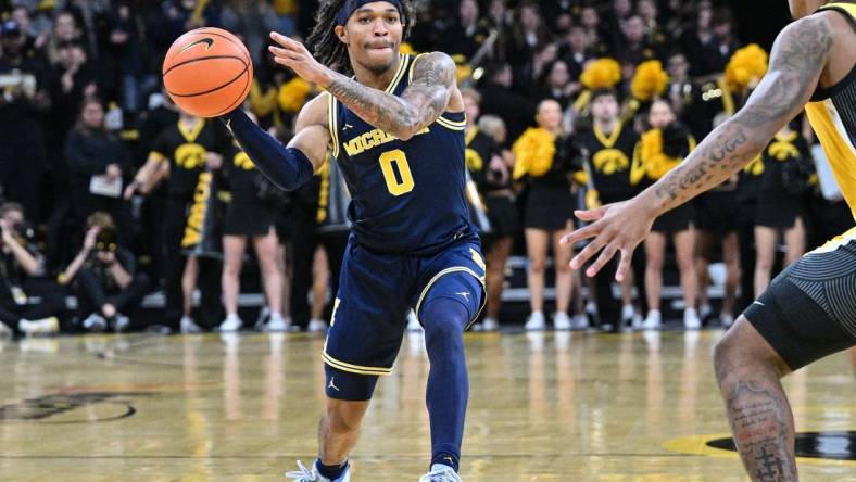 Dec 10, 2023; Iowa City, Iowa, USA; Michigan Wolverines guard Dug McDaniel (0) in action during the game against the Iowa Hawkeyes at Carver-Hawkeye Arena. Mandatory Credit: Jeffrey Becker-USA TODAY Sports