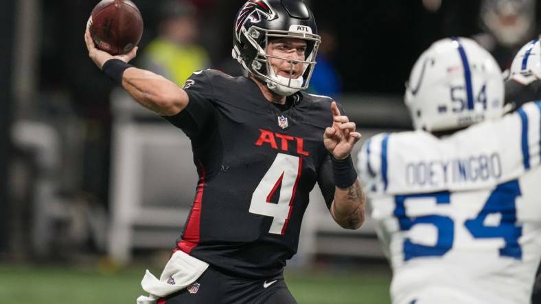 Dec 24, 2023; Atlanta, Georgia, USA; Atlanta Falcons quarterback Taylor Heinicke (4) passes the ball against the Indianapolis Colts during the first half at Mercedes-Benz Stadium. Mandatory Credit: Dale Zanine-USA TODAY Sports