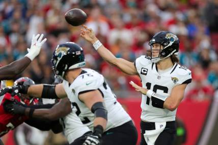 Dec 24, 2023; Tampa, Florida, USA;  Jacksonville Jaguars quarterback Trevor Lawrence (16) drops back to pass against the Tampa Bay Buccaneers in the second quarter at Raymond James Stadium. Mandatory Credit: Nathan Ray Seebeck-USA TODAY Sports