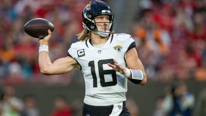 Dec 24, 2023; Tampa, Florida, USA; Jacksonville Jaguars quarterback Trevor Lawrence (16) throws the ball against the Tampa Bay Buccaneers in the second quarter at Raymond James Stadium. Mandatory Credit: Jeremy Reper-USA TODAY Sports