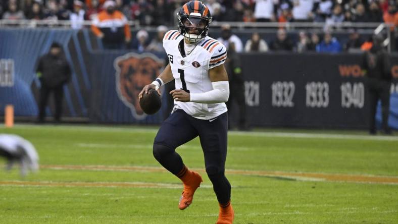 Dec 24, 2023; Chicago, Illinois, USA;  Chicago Bears quarterback Justin Fields (1) looks to pass the ball against the Arizona Cardinals during the first half at Soldier Field. Mandatory Credit: Matt Marton-USA TODAY Sports