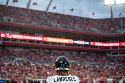Dec 24, 2023; Tampa, Florida, USA; Jacksonville Jaguars quarterback Trevor Lawrence (16) on the sideline against the Tampa Bay Buccaneers in the third quarter at Raymond James Stadium. Mandatory Credit: Jeremy Reper-USA TODAY Sports