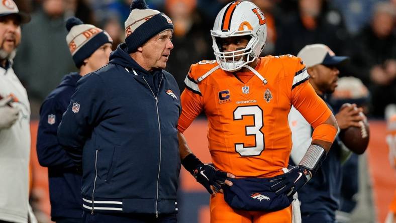 Dec 24, 2023; Denver, Colorado, USA; Denver Broncos head coach Sean Payton talks with quarterback Russell Wilson (3) before the game against the New England Patriots at Empower Field at Mile High. Mandatory Credit: Isaiah J. Downing-USA TODAY Sports