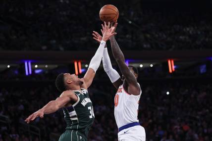 Dec 25, 2023; New York, New York, USA; New York Knicks forward Julius Randle (30) shoots the ball as Milwaukee Bucks forward Giannis Antetokounmpo (34) defends during the first half at Madison Square Garden. Mandatory Credit: Vincent Carchietta-USA TODAY Sports