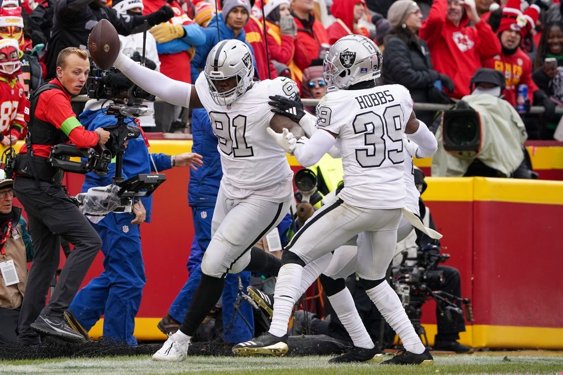 Dec 25, 2023; Kansas City, Missouri, USA; Las Vegas Raiders defensive tackle Bilal Nichols (91) scores against the Kansas City Chiefs after picking up a fumble during the first half at GEHA Field at Arrowhead Stadium. Mandatory Credit: Denny Medley-USA TODAY Sports