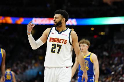 Dec 25, 2023; Denver, Colorado, USA; Denver Nuggets guard Jamal Murray (27) reacts in the first quarter against the Golden State Warriors at Ball Arena. Mandatory Credit: Ron Chenoy-USA TODAY Sports