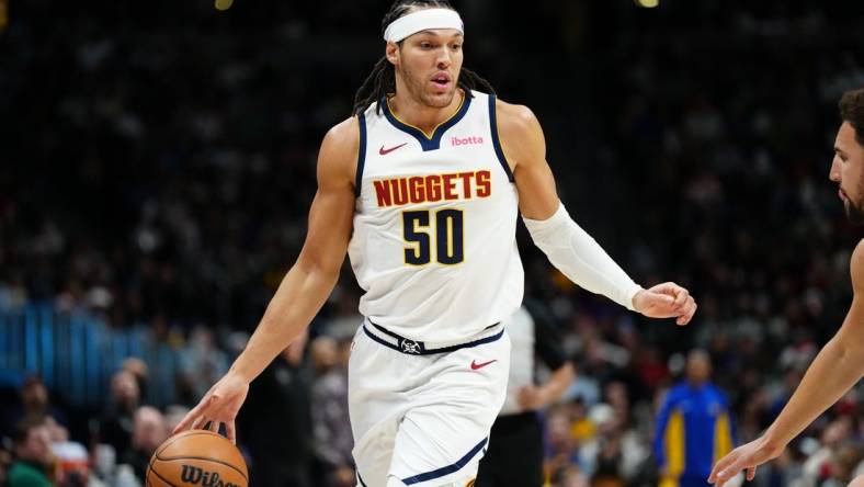 Dec 25, 2023; Denver, Colorado, USA; Denver Nuggets forward Aaron Gordon (50) during  the third quarter against the Golden State Warriors at Ball Arena. Mandatory Credit: Ron Chenoy-USA TODAY Sports