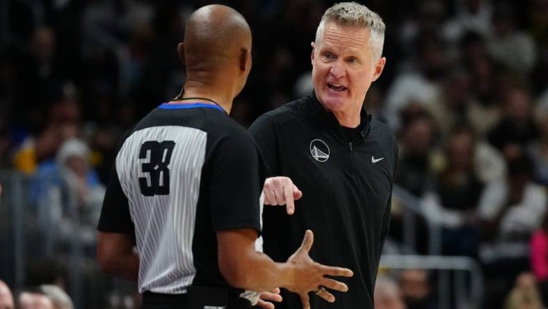 Dec 25, 2023; Denver, Colorado, USA; Golden State Warriors head coach Steve Kerr talks to referee Michael Smith (38) in the second half against the Denver Nuggets at Ball Arena. Mandatory Credit: Ron Chenoy-USA TODAY Sports