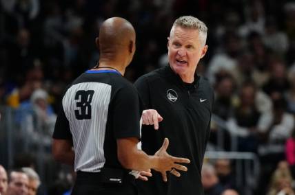 Dec 25, 2023; Denver, Colorado, USA; Golden State Warriors head coach Steve Kerr talks to referee Michael Smith (38) in the second half against the Denver Nuggets at Ball Arena. Mandatory Credit: Ron Chenoy-USA TODAY Sports