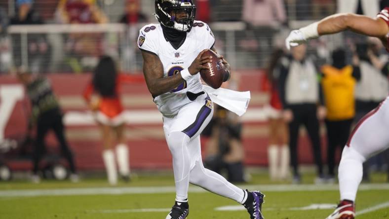 Dec 25, 2023; Santa Clara, California, USA; Baltimore Ravens quarterback Lamar Jackson (8) looks to throw a pass against the San Francisco 49ers in the first quarter at Levi's Stadium. Mandatory Credit: Cary Edmondson-USA TODAY Sports