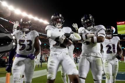 Dec 25, 2023; Santa Clara, California, USA; Baltimore Ravens linebacker Del'Shawn Phillips (53), safety Marcus Williams (32), and cornerback Daryl Worley (41) celebrate in the end zone after Williams intercepted a pass against the San Francisco 49ers in the fourth quarter at Levi's Stadium. Mandatory Credit: Cary Edmondson-USA TODAY Sports