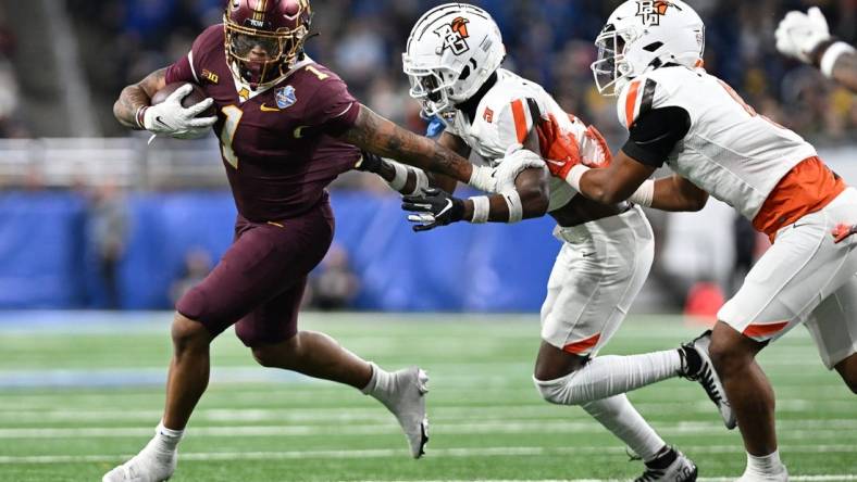 Dec 26, 2023; Detroit, MI, USA;  Minnesota Golden Gophers running back Darius Taylor (1) runs the ball against the Bowling Green Falcons in the first quarter at Ford Field. Mandatory Credit: Lon Horwedel-USA TODAY Sports