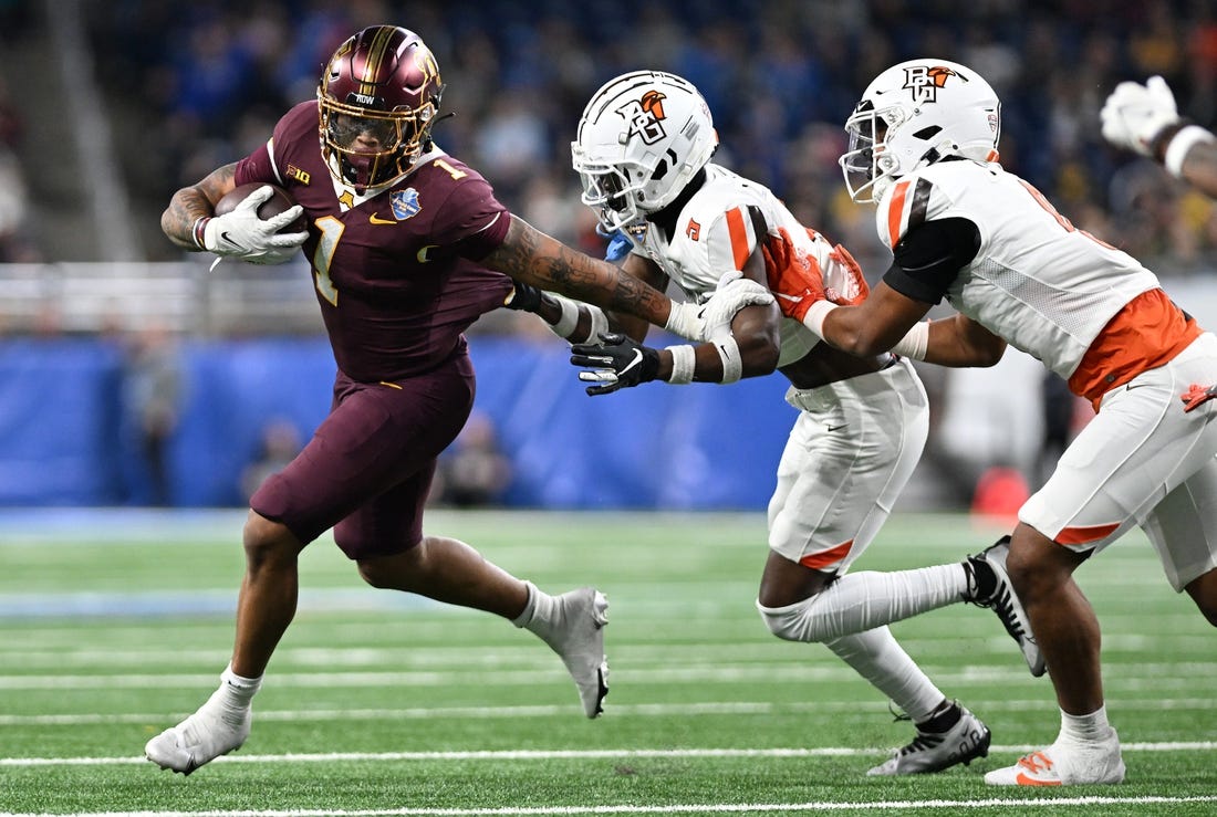 Dec 26, 2023; Detroit, MI, USA;  Minnesota Golden Gophers running back Darius Taylor (1) runs the ball against the Bowling Green Falcons in the first quarter at Ford Field. Mandatory Credit: Lon Horwedel-USA TODAY Sports