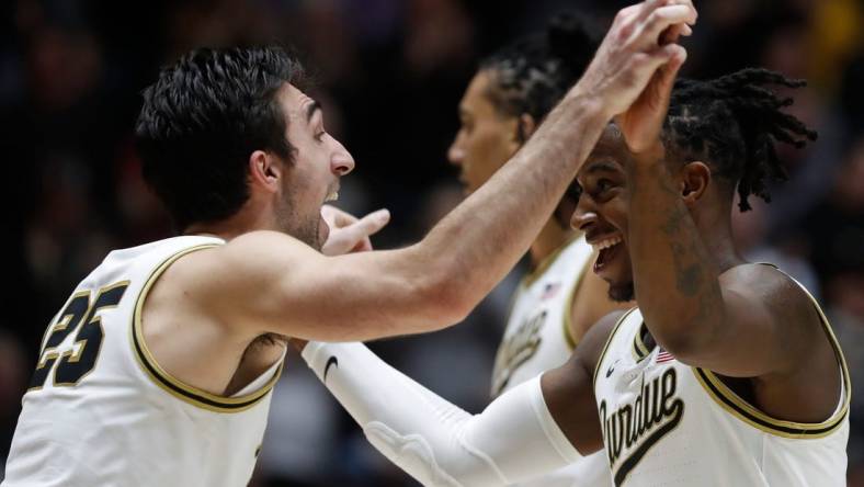 Purdue Boilermakers guard Ethan Morton (25) and Purdue Boilermakers guard Lance Jones (55) celebrate during the NCAA men   s basketball game against the Iowa Hawkeyes, Monday, Dec. 4, 2023, at Mackey Arena in West Lafayette, Ind. Purdue Boilermakers 87-68.