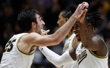 Purdue Boilermakers guard Ethan Morton (25) and Purdue Boilermakers guard Lance Jones (55) celebrate during the NCAA men   s basketball game against the Iowa Hawkeyes, Monday, Dec. 4, 2023, at Mackey Arena in West Lafayette, Ind. Purdue Boilermakers 87-68.