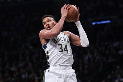 Dec 27, 2023; Brooklyn, New York, USA; Milwaukee Bucks forward Giannis Antetokounmpo (34) rebounds during the first quarter against the Brooklyn Nets at Barclays Center. Mandatory Credit: Vincent Carchietta-USA TODAY Sports