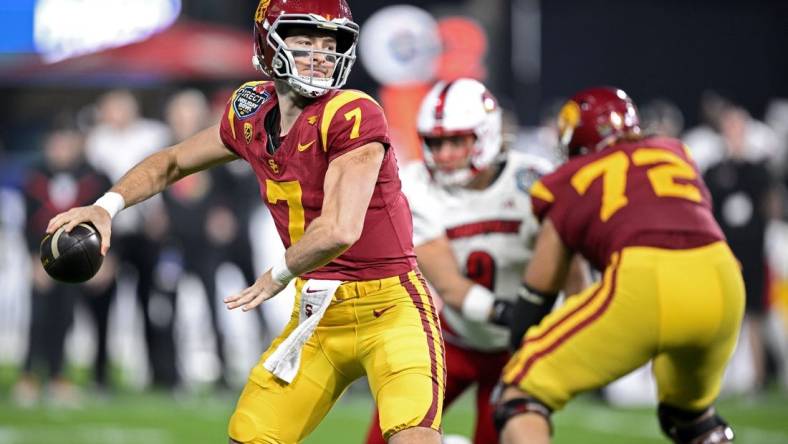 Dec 27, 2023; San Diego, CA, USA; USC Trojans quarterback Miller Moss (7) throws a pass against the Louisville Cardinals during the first half at Petco Park. Mandatory Credit: Orlando Ramirez-USA TODAY Sports