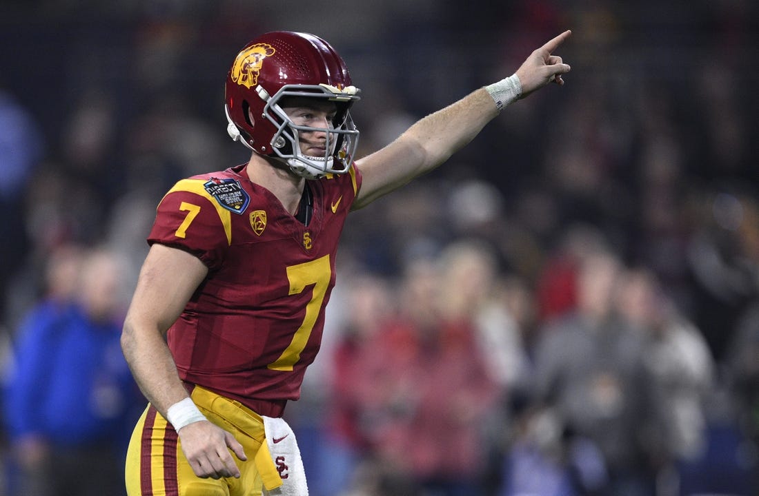 Dec 27, 2023; San Diego, CA, USA; USC Trojans quarterback Miller Moss (7) gestures during a running play against the Louisville Cardinals in the second half at Petco Park. Mandatory Credit: Orlando Ramirez-USA TODAY Sports