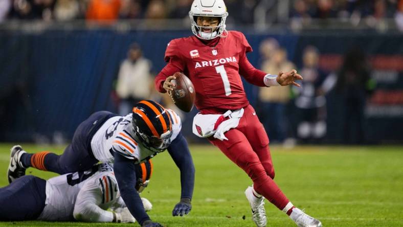 Dec 24, 2023; Chicago, Illinois, USA;  Arizona Cardinals quarterback Kyler Murray (1) runs with the ball against the Chicago Bears at Soldier Field. Mandatory Credit: Jamie Sabau-USA TODAY Sports