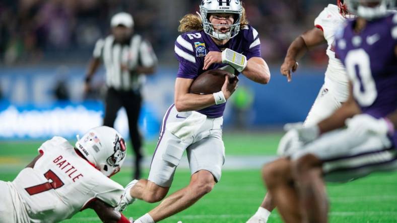 Dec 28, 2023; Orlando, FL, USA; Kansas State quarterback Avery Johnson (2) runs for the touchdown against NC State in the second quarter at Camping World Stadium. Mandatory Credit: Jeremy Reper-USA TODAY Sports