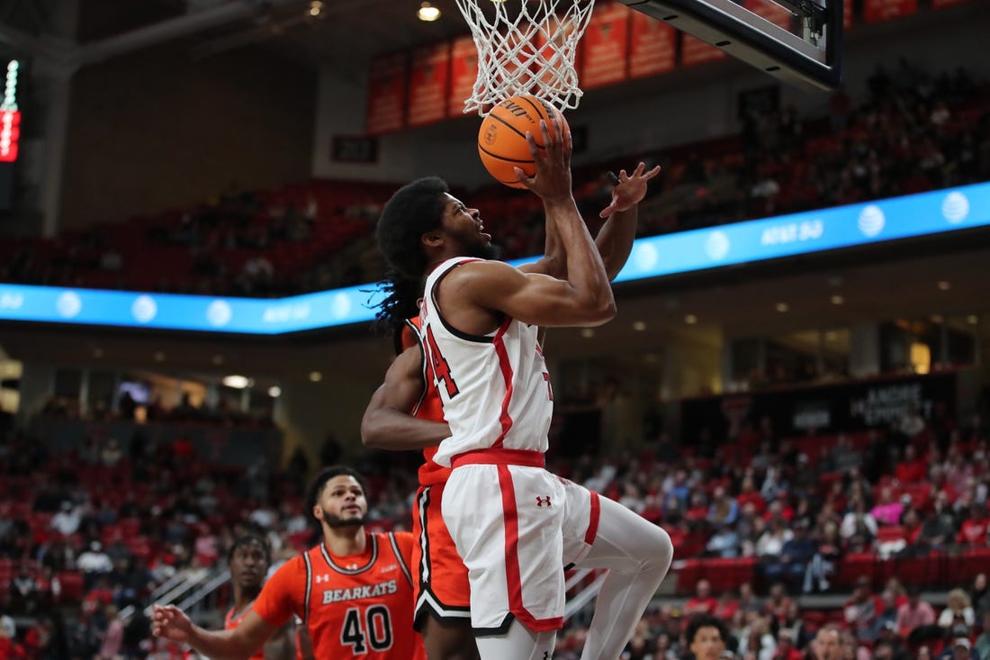 Dec 28, 2023; Lubbock, Texas, USA; Texas Tech Red Raiders guard Kerwin Walton (24) goes to the basket against the Sam Houston Bearkats in the first half at United Supermarkets Arena. Mandatory Credit: Michael C. Johnson-USA TODAY Sports