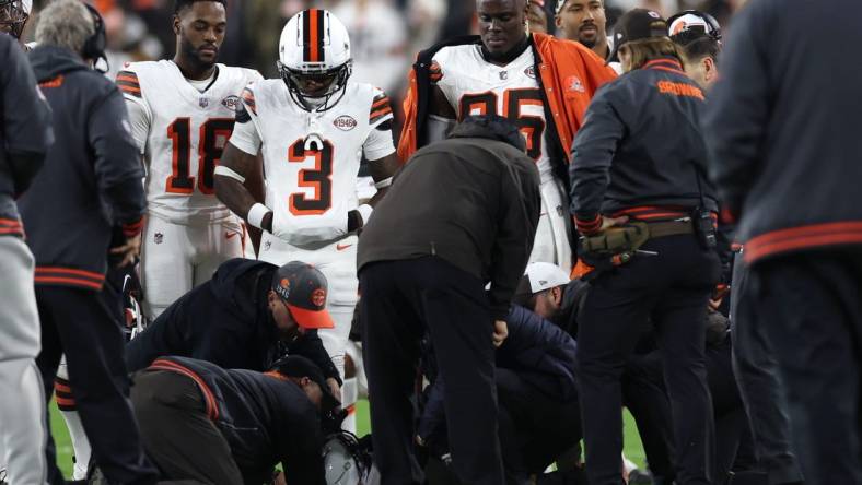 Dec 28, 2023; Cleveland, Ohio, USA; Cleveland Browns wide receiver Elijah Moore (8) is checked on by trainers during the first half against the New York Jets at Cleveland Browns Stadium. Mandatory Credit: Scott Galvin-USA TODAY Sports