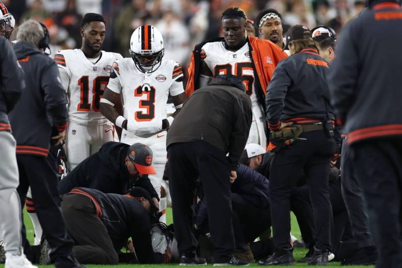 Dec 28, 2023; Cleveland, Ohio, USA; Cleveland Browns wide receiver Elijah Moore (8) is checked on by trainers during the first half against the New York Jets at Cleveland Browns Stadium. Mandatory Credit: Scott Galvin-USA TODAY Sports