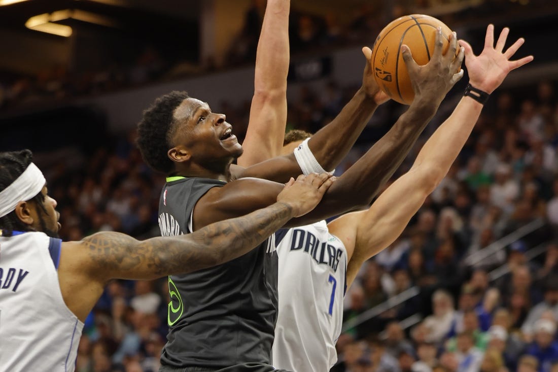 Dec 28, 2023; Minneapolis, Minnesota, USA; Dallas Mavericks guard Jaden Hardy (1) fouls Minnesota Timberwolves guard Anthony Edwards (5) as he goes to the basket in the third quarter at Target Center. Mandatory Credit: Bruce Kluckhohn-USA TODAY Sports