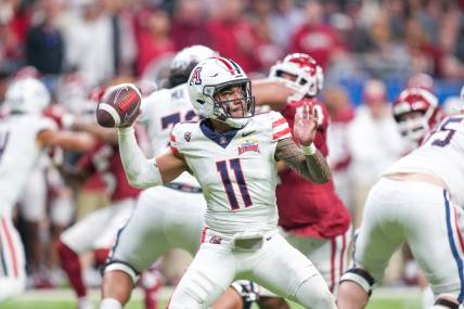 Dec 28, 2023; San Antonio, TX, USA;  Arizona Wildcats quarterback Noah Fifita (11) throws a pass in the first half against the Oklahoma Sooners at Alamodome. Mandatory Credit: Daniel Dunn-USA TODAY Sports