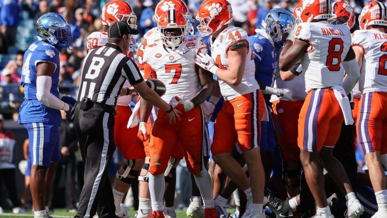 Dec 29, 2023; Jacksonville, FL, USA;  Clemson Tigers running back Phil Mafah (7) runs the ball into the end zone for a touchdown against the Kentucky Wildcats in the second quarter during the Gator Bowl at EverBank Stadium. Mandatory Credit: Nathan Ray Seebeck-USA TODAY Sports