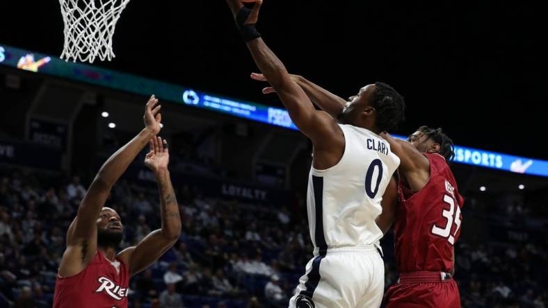 Dec 29, 2023; University Park, Pennsylvania, USA; Penn State Nittany Lions guard Kanye Clary (0) drives the ball to the basket as Rider Broncs guard TJ Weeks Jr (35) defends during the first half at Bryce Jordan Center. Mandatory Credit: Matthew O'Haren-USA TODAY Sports