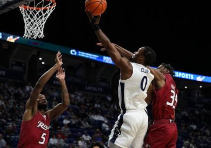 Dec 29, 2023; University Park, Pennsylvania, USA; Penn State Nittany Lions guard Kanye Clary (0) drives the ball to the basket as Rider Broncs guard TJ Weeks Jr (35) defends during the first half at Bryce Jordan Center. Mandatory Credit: Matthew O'Haren-USA TODAY Sports