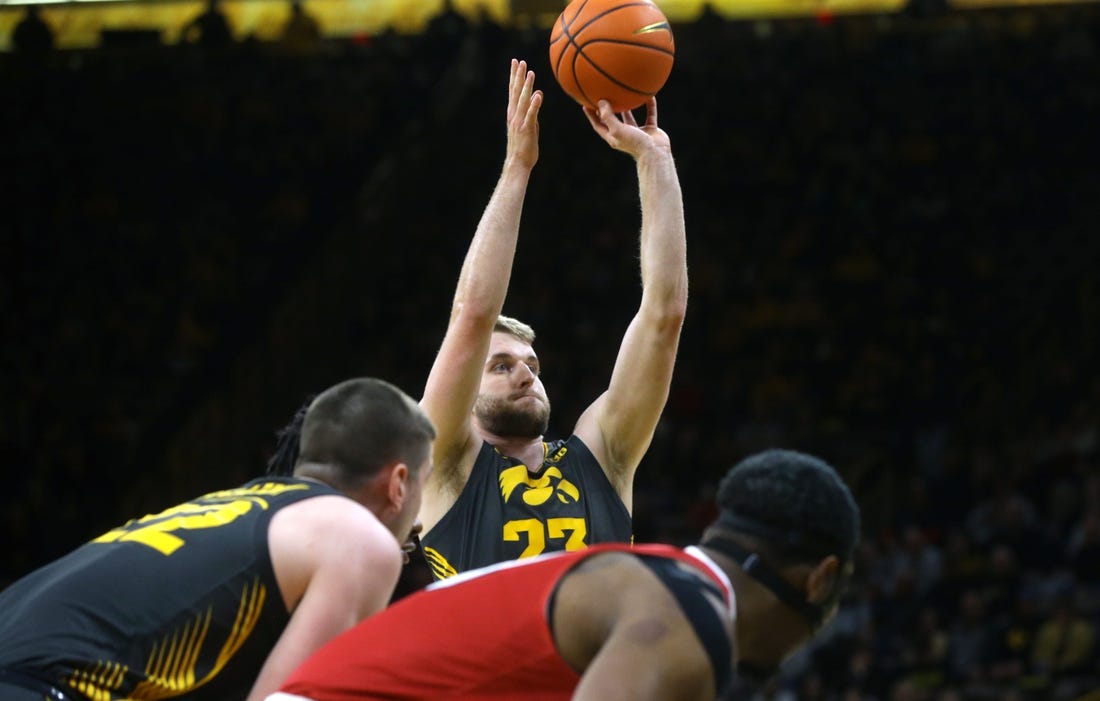 Iowa's Ben Krikke (23) attempts a free throw against Northern Illinois Friday, Dec. 29, 2023 at Carver-Hawkeye Arena in Iowa City, Iowa.