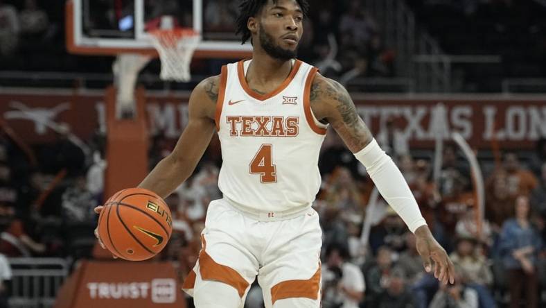 Dec 29, 2023; Austin, Texas, USA; Texas Longhorns guard Tyrese Hunter (4) dribbles during the first half against UNC Greensboro at Moody Center. Mandatory Credit: Scott Wachter-USA TODAY Sports