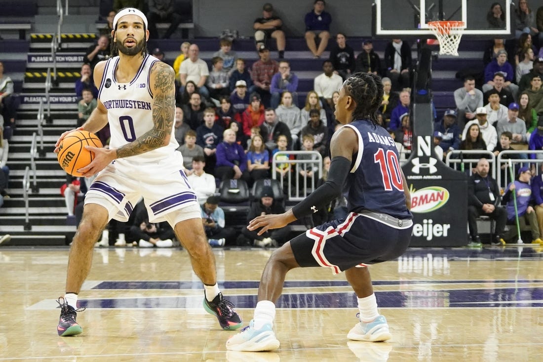 Dec 29, 2023; Evanston, Illinois, USA; Jackson State Tigers guard Chase Adams (10) defends Northwestern Wildcats guard Boo Buie (0) during the first half at Welsh-Ryan Arena. Mandatory Credit: David Banks-USA TODAY Sports