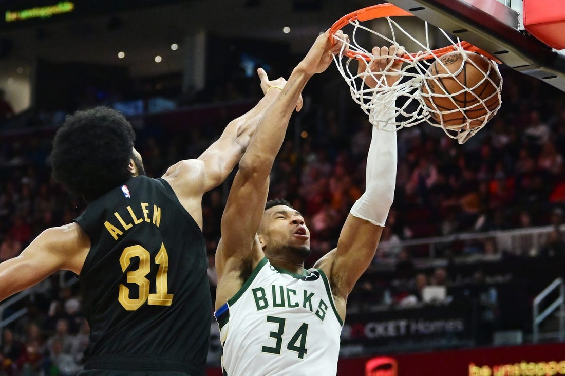 Dec 29, 2023; Cleveland, Ohio, USA; Milwaukee Bucks forward Giannis Antetokounmpo (34) dunks as Cleveland Cavaliers center Jarrett Allen (31) defends during the second half at Rocket Mortgage FieldHouse. Mandatory Credit: Ken Blaze-USA TODAY Sports